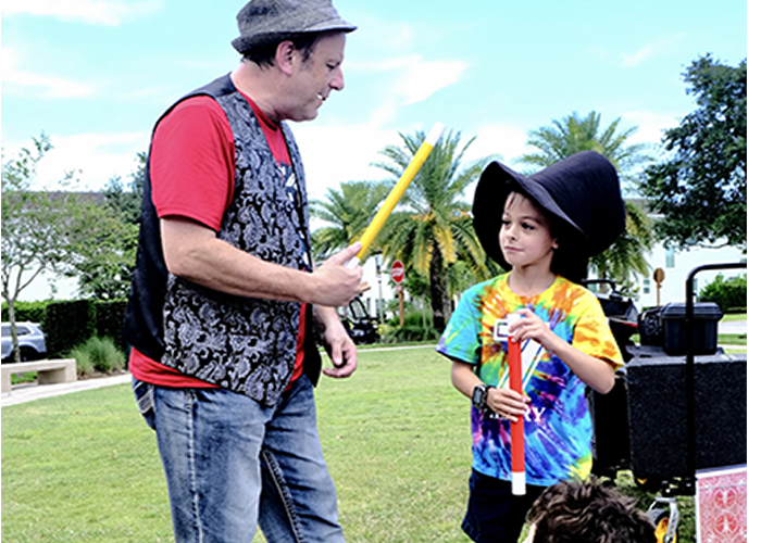 Eric performing magic at a birthday party